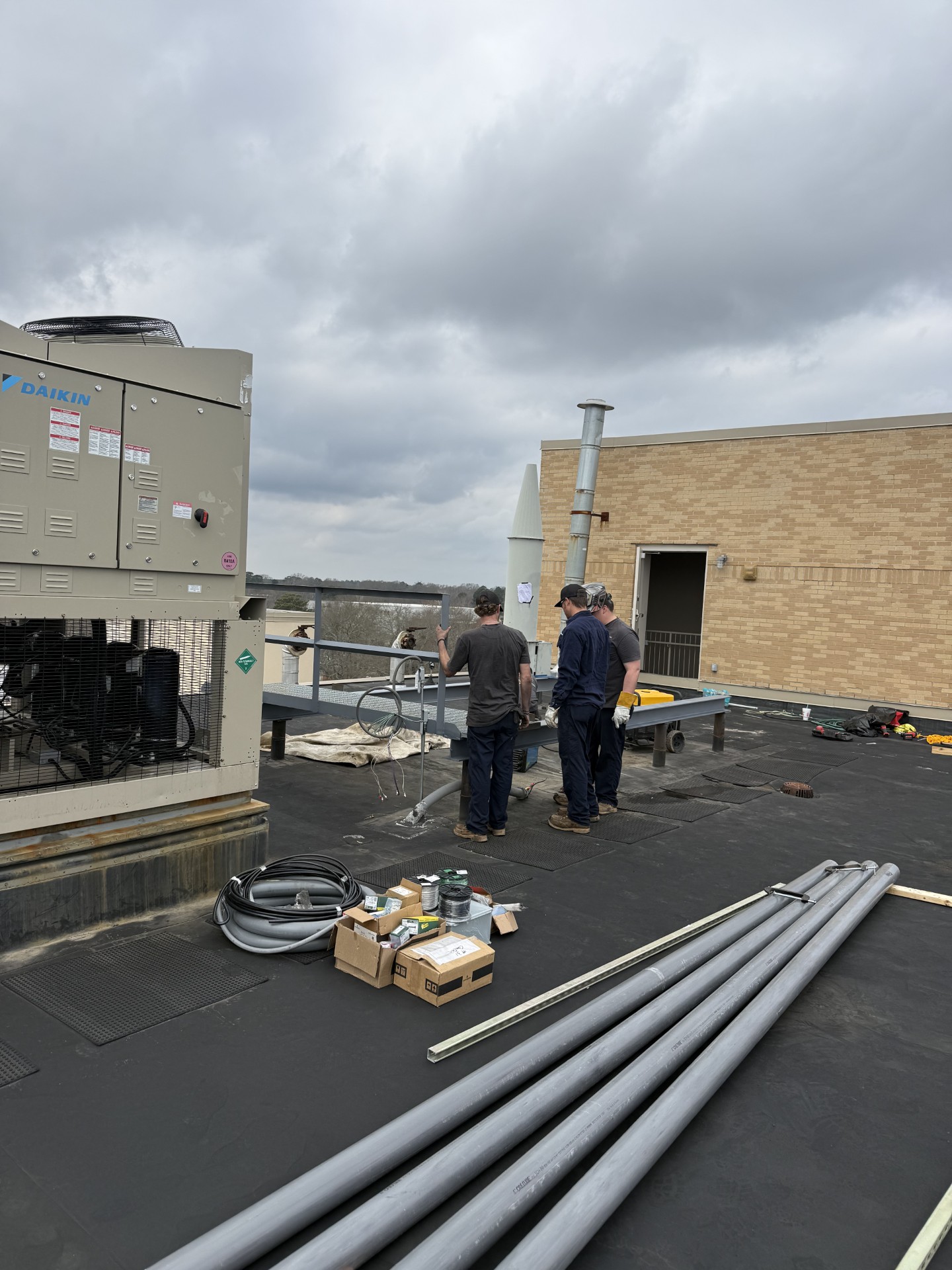 S&S Services crew installing rooftop equipment at Minden Medical Center